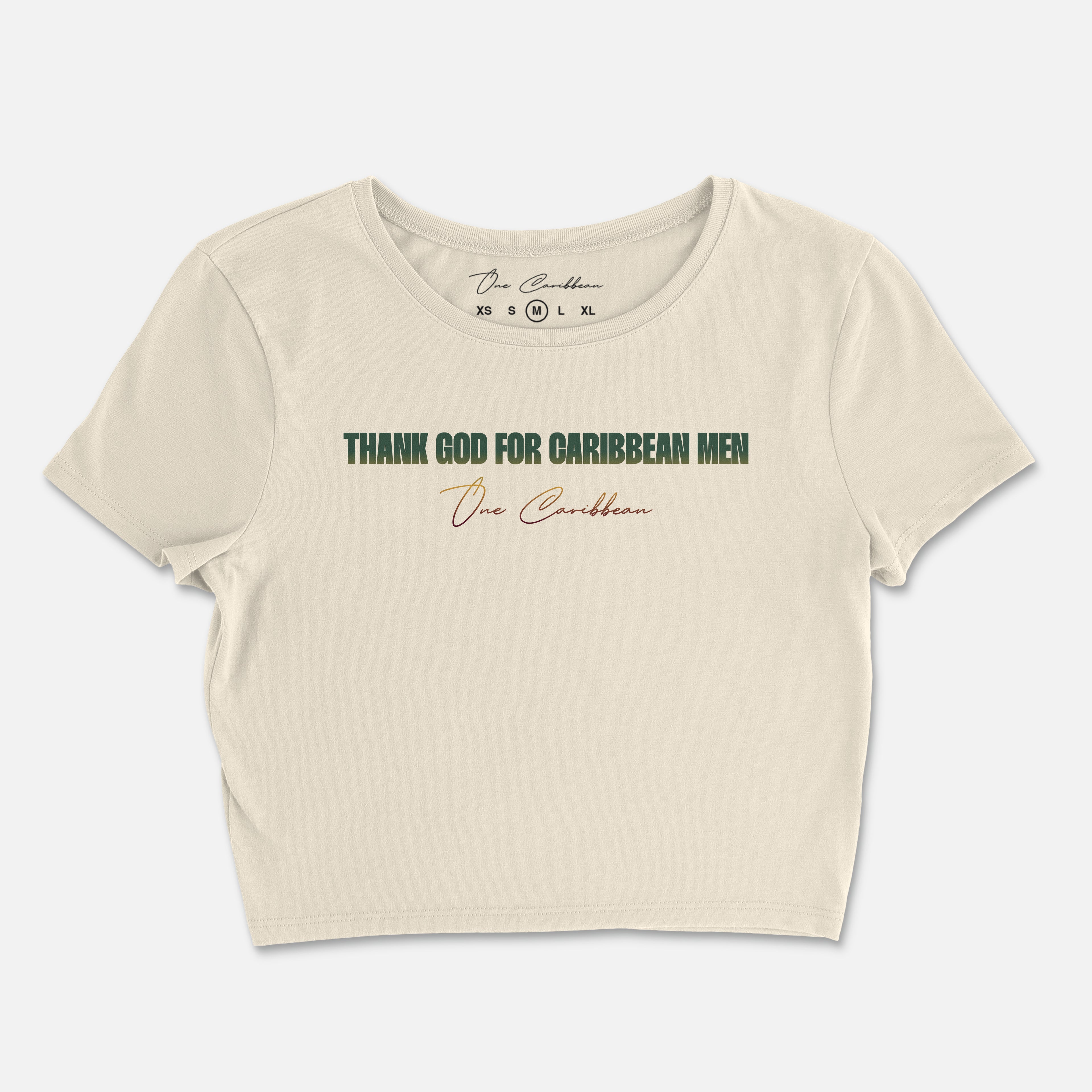 An ivory crop top with the text 'THANK GOD FOR CARIBBEAN MEN' printed in gradient colors on the back.
