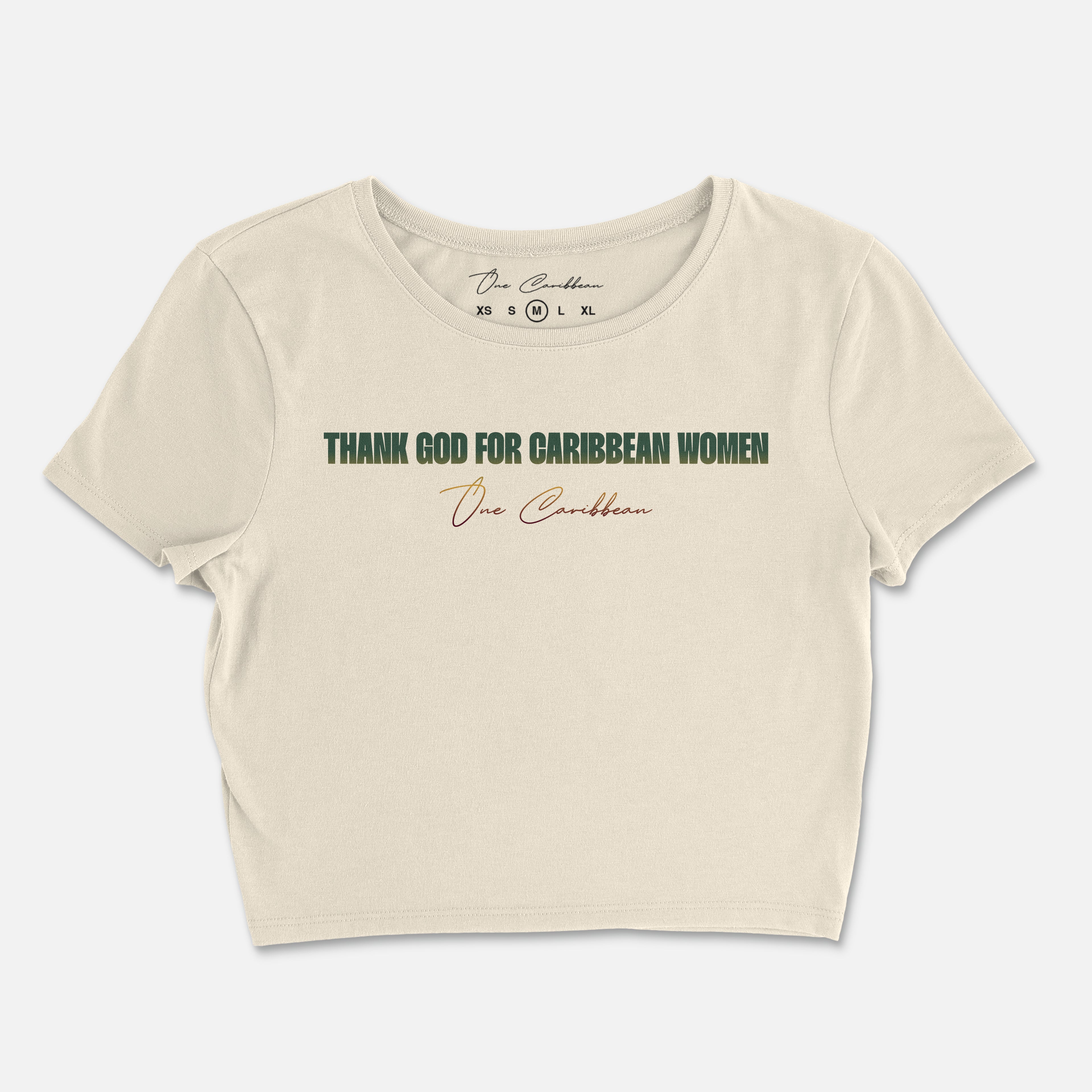 A beige crop top with the text 'THANK GOD FOR CARIBBEAN WOMEN' printed across the front.